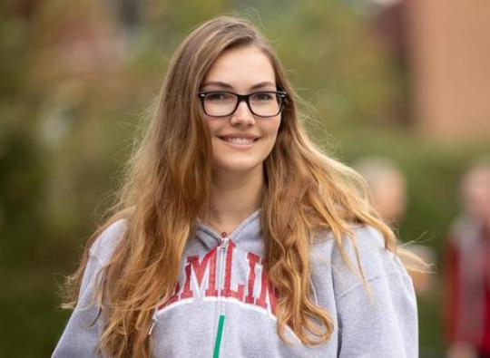 Hailey Belflower 侫Ƶ Transfer Student  holding a coffee at 侫Ƶ